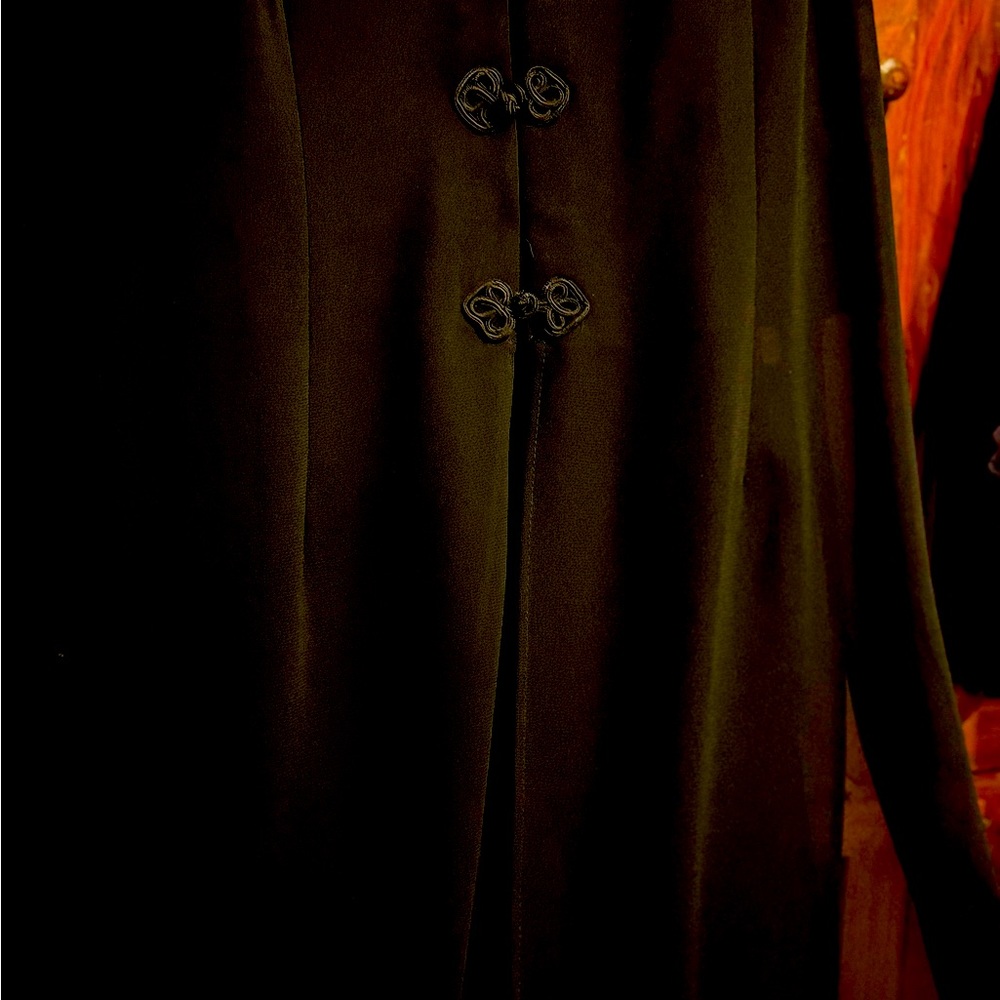 Black pants and flowing top. 16 W